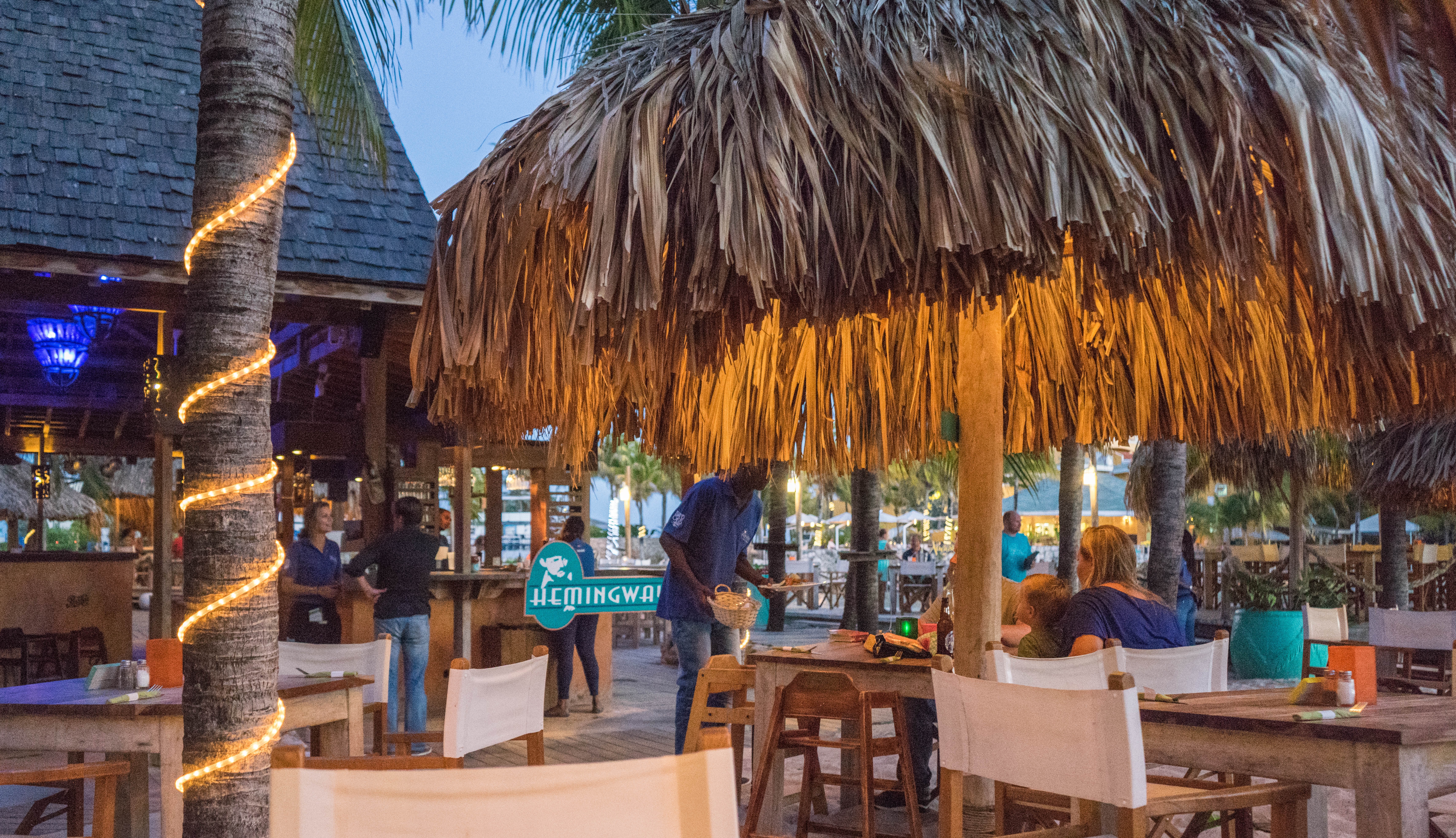 Vibrant tropical bar on Taniti island with exotic cocktails and beachside ambiance